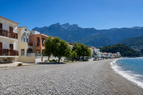 Kokkari–Tarsanas Beach on Samos with a pebble shore and clear blue waters