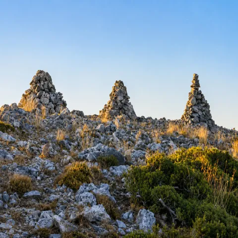 Ruins of Lazaros Castle on Mount Karvounis, surrounded by nature