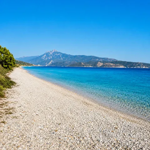 Mykali Beach in Samos with fine pebbles and views of Asia Minor